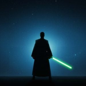 Back of robed Jedi with lightsaber at night looking at stars